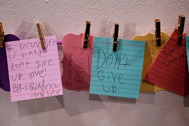 Eleazar-Yisrael Smith, 10, is part of the "Stories in Stereo" an interactive exhibit that has handwritten notes at the Detroit Historical Museum. The unique thing is his father Emmanuel Smith, 43, also has an installation right next door that highlights his regional Emmy trophies for his Mr. E in the D productions photographed at the Detroit Historical Museum in Detroit on Tuesday, Feb. 20, 2024.
