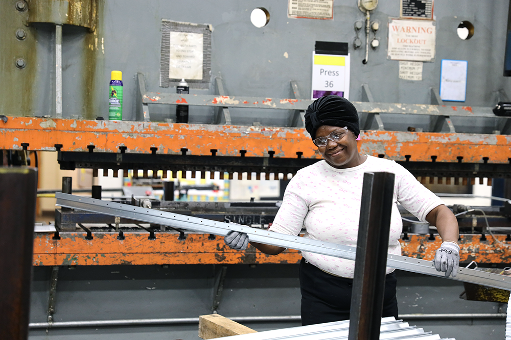 Black American solar manufacturing worker.