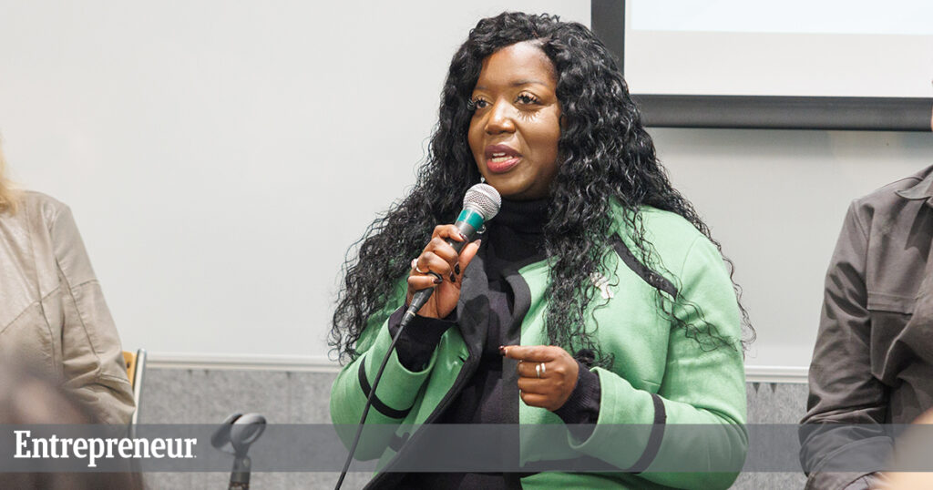 Shakenna Williams speaks into a mircrophone during a panel discussion